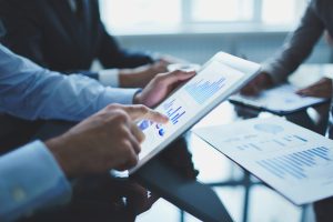 close up businessman with digital tablet scaled 1