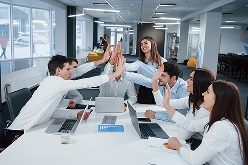 cheerful business people job is done group office workers happy hit their own records being successful
