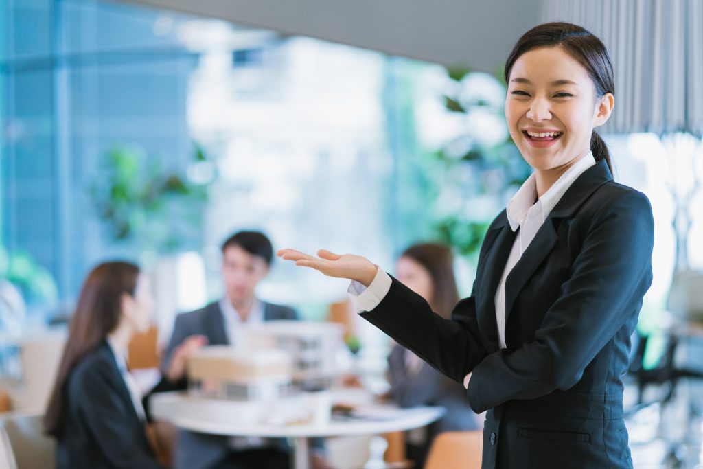 portrait close up smart attractive asian business female smile with confident leadership modern office background