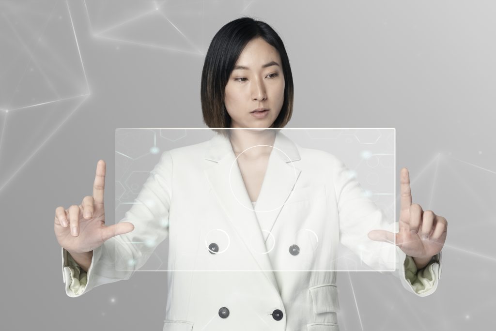 asian woman using futuristic transparent screen digital remix